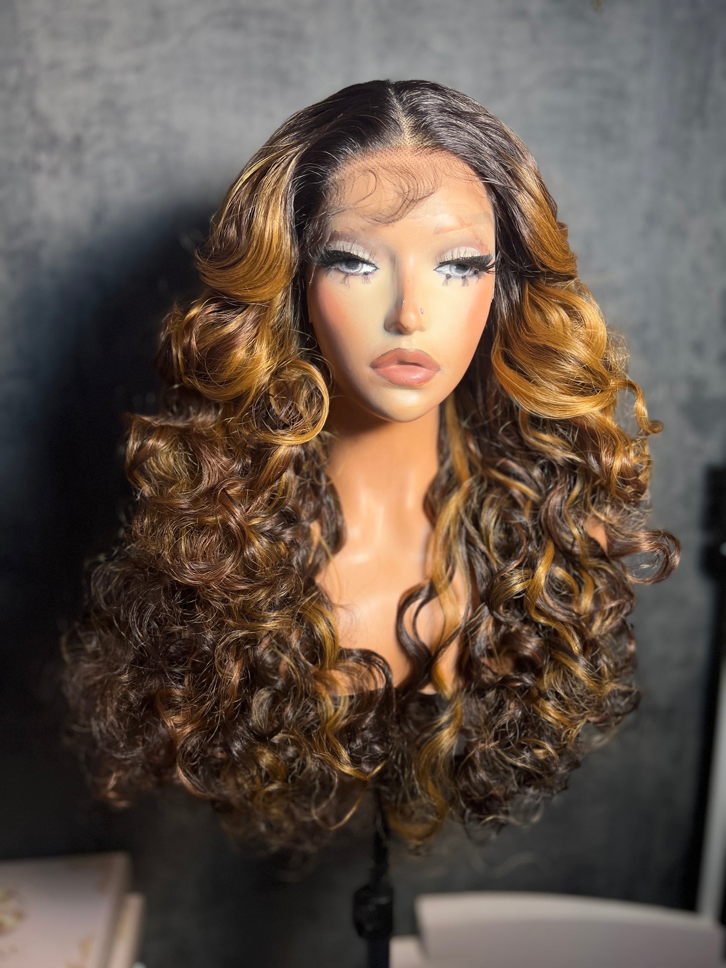 Lenisha 13x7 free part lace front wig in Golden Chestnut, honey highlights on dark roots, 24 inch curls