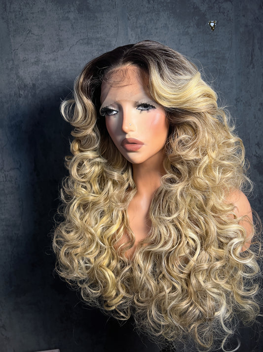 Lenisha 13x7 free part lace front wig in Ash Blonde with dark roots, 24 inch bouncy curls, front view